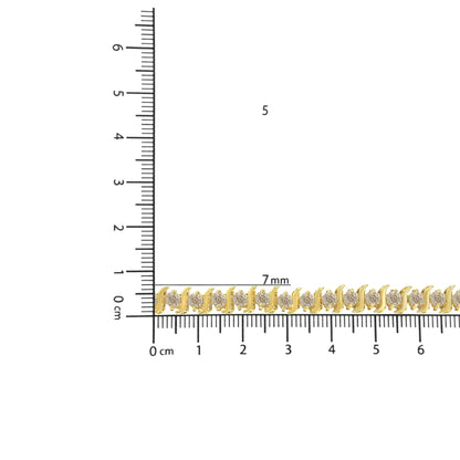 Yellow metal bracelet with round white gemstones in prong settings, shown lying flat on ruler for size reference, angled from above.