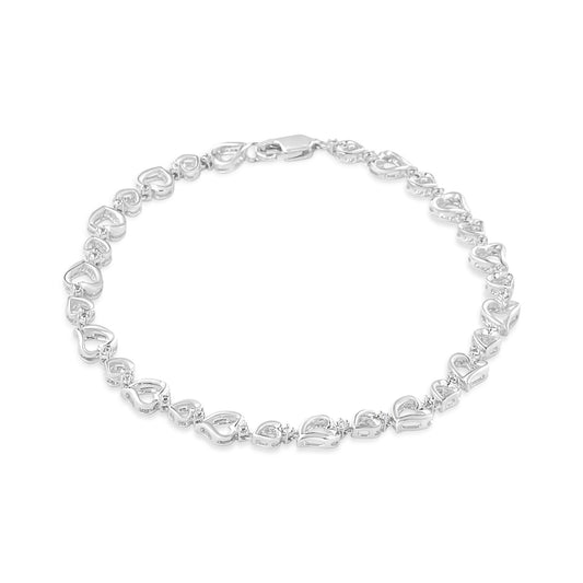 White metal bracelet with heart-shaped links and small white gemstones, shown from a top front angle on a white background.