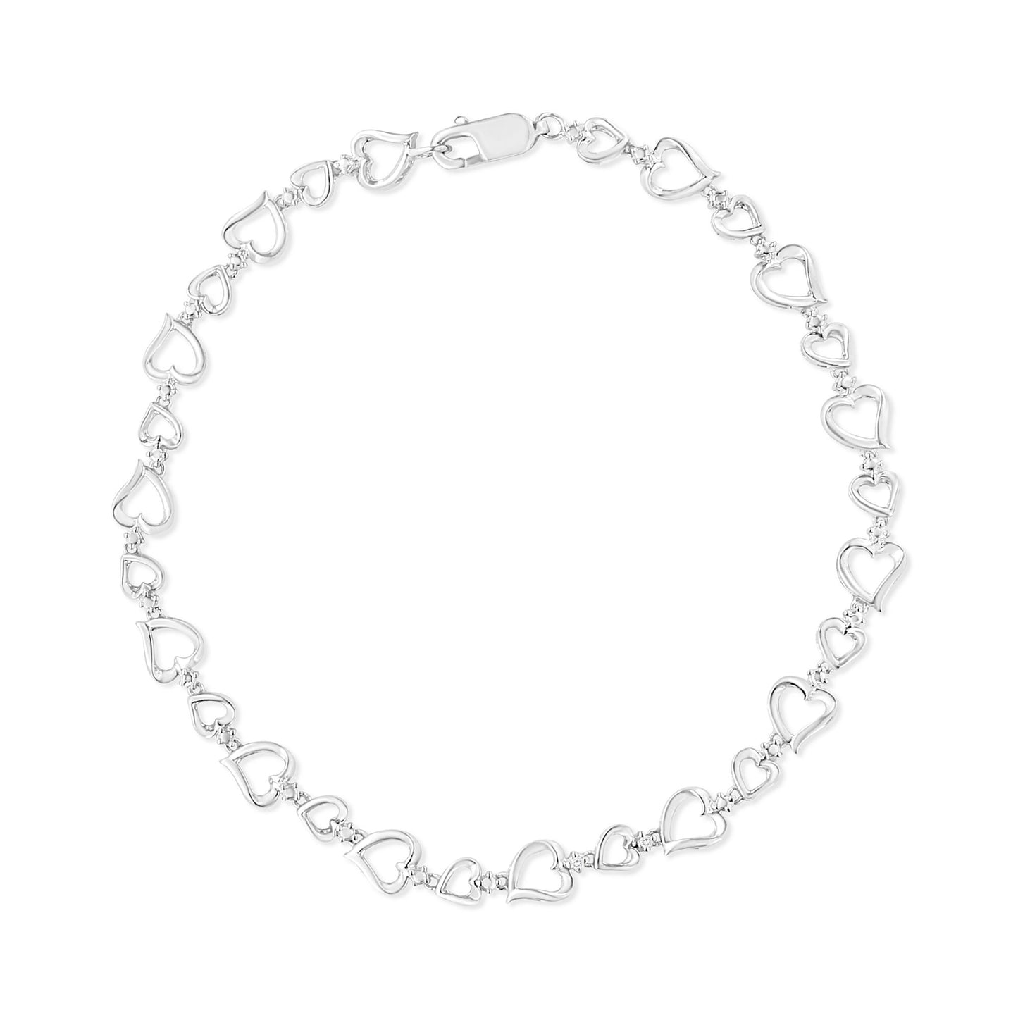 Top-down view of a white metal bracelet featuring alternating small heart-shaped links connected by two round white gemstones in prong settings.