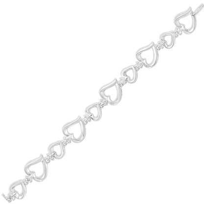 White metal bracelet with alternating open heart shapes connected by small links, each link set with a round white gemstone, shown in a flat diagonal top-down view.
