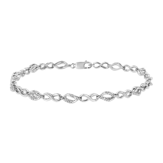 White metal bracelet with alternating twisted links, some adorned with small white round prong-set gemstones, shown from a front angle.