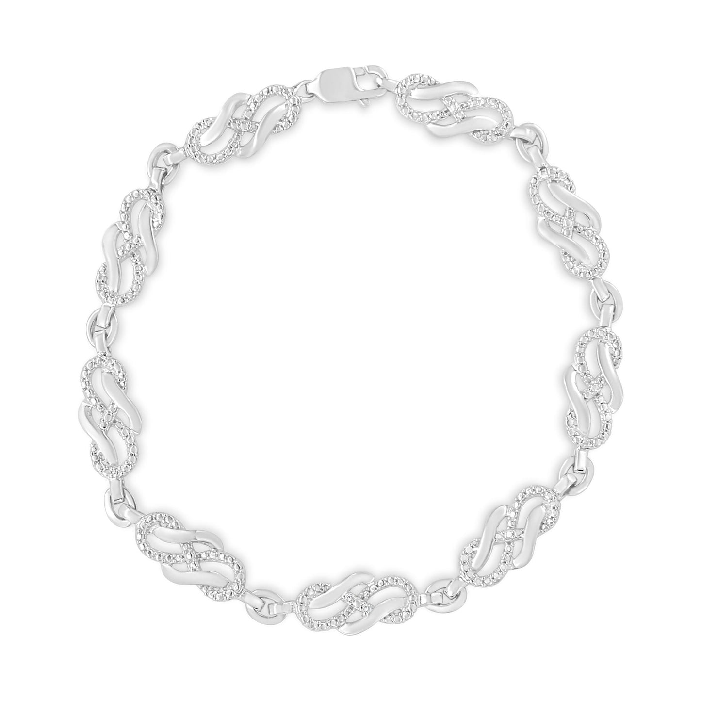 Top-down view of a white metal bracelet with alternating links, some featuring round white gemstones in prong settings.