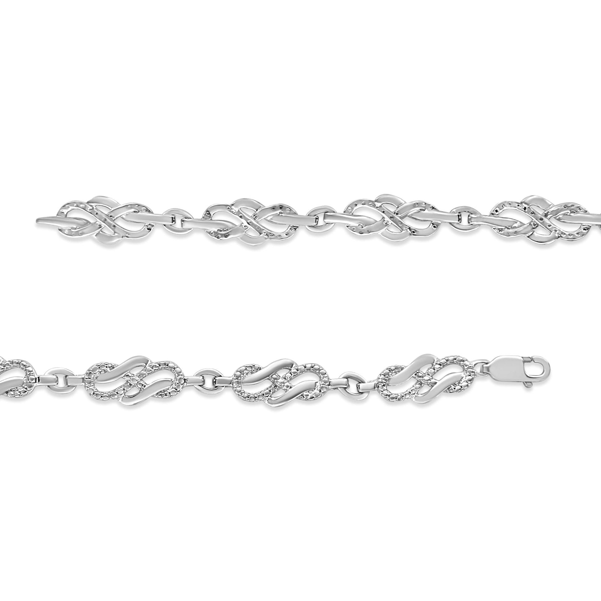 Two white metal bracelets with interlocking loop designs, one set with small white gemstones, shown from a top flat angle.