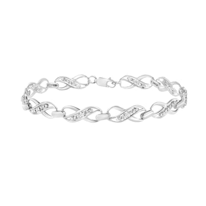 White metal bracelet with alternating twisted link design featuring round white gemstones in prong settings, shown in a side angle view.
