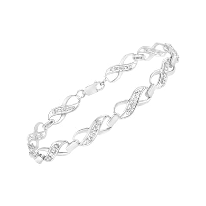 White metal bracelet with alternating smooth and gemstone-studded twisted links, shown at an angle on a white background.