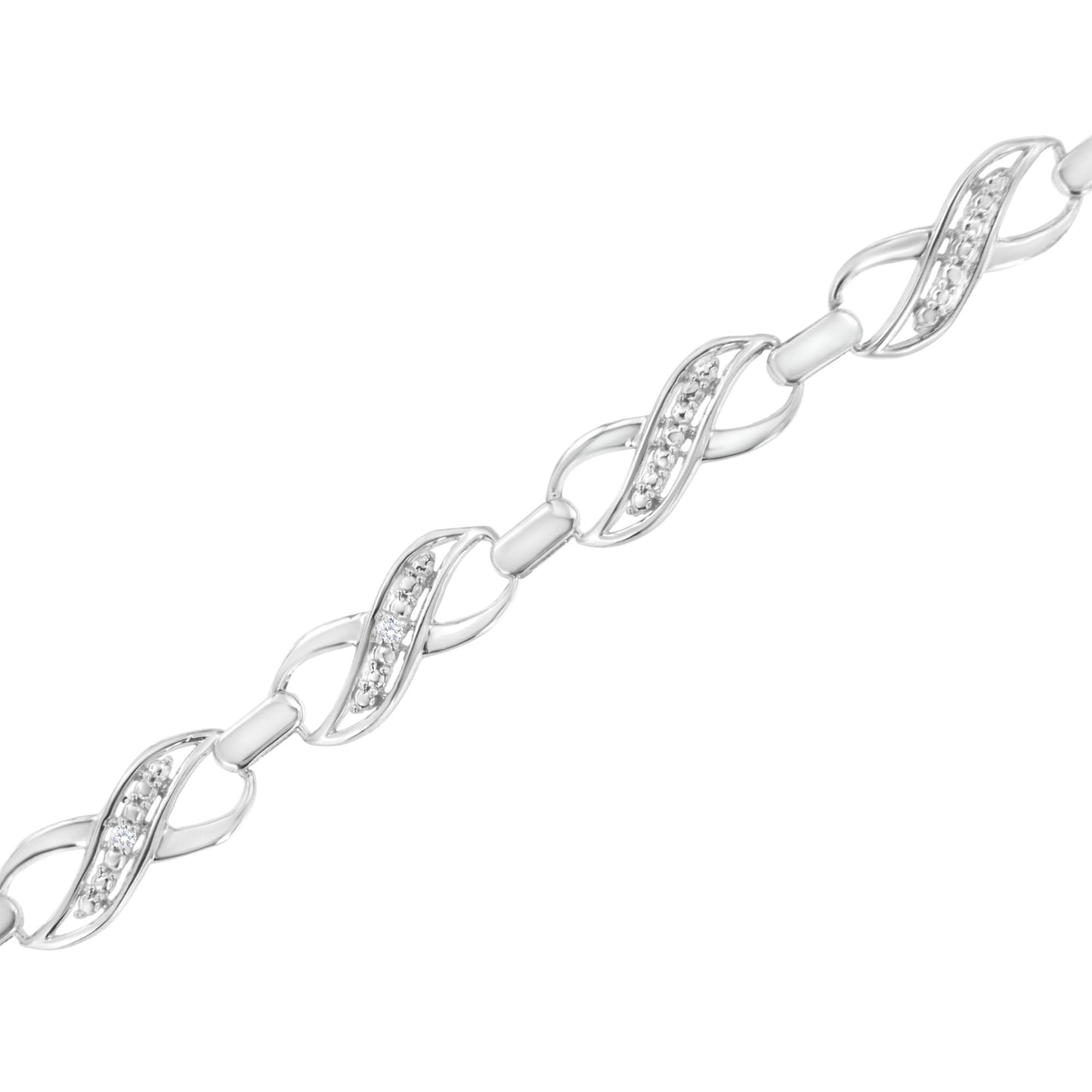 Diagonal close-up of a white metal bracelet featuring linked infinity-shaped segments, each set with small round white gemstones in prong settings.