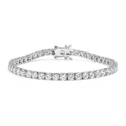 White metal tennis bracelet with round white gemstones in 4-prong settings, shown from a low front angle.