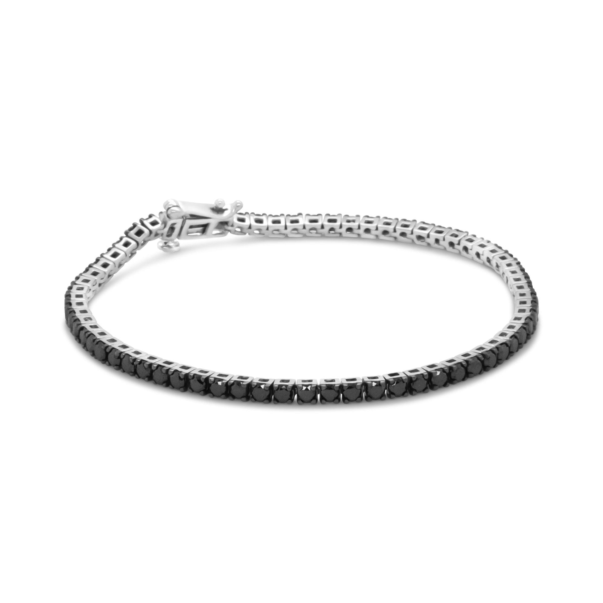 White bracelet with round black gemstones in prong settings, shown from a slightly elevated side angle.