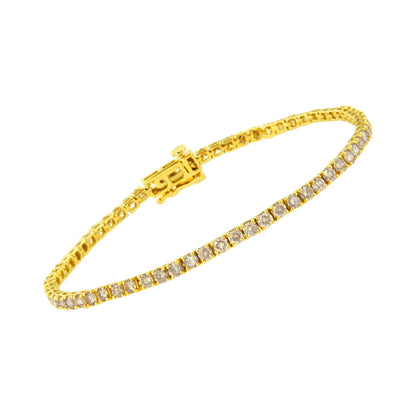 Yellow metal bracelet with round brownish gemstones in prong settings, shown at a slight angled top-down view.