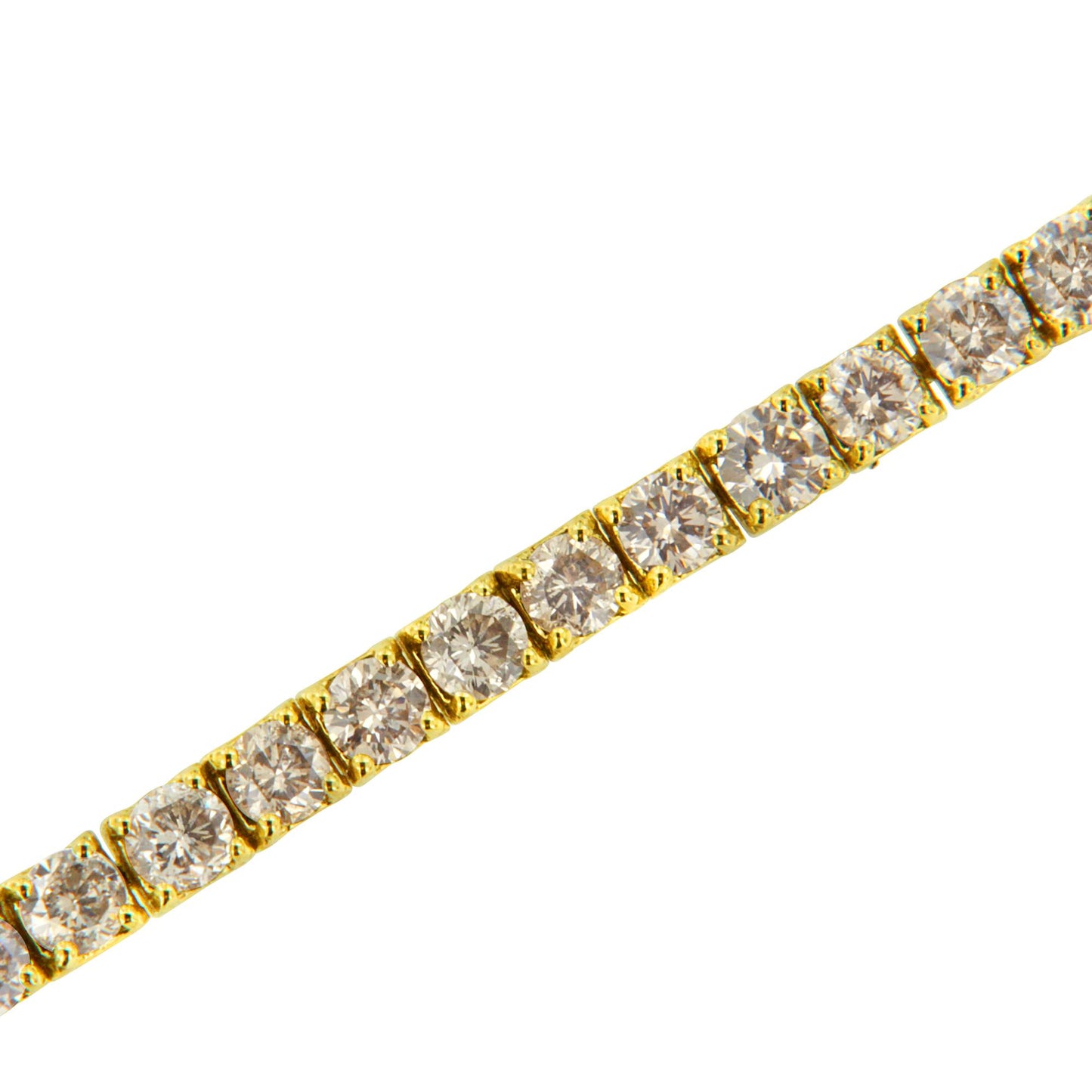 Close-up angled view of a yellow metal bracelet featuring round brownish gemstones in prong settings.