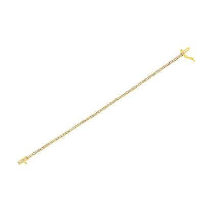 Yellow metal bracelet with round white gemstones in prong settings, shown from a top flat angle.