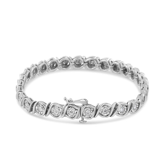 White metal bracelet with round white gemstones in a miracle setting, shown at an angled top view.