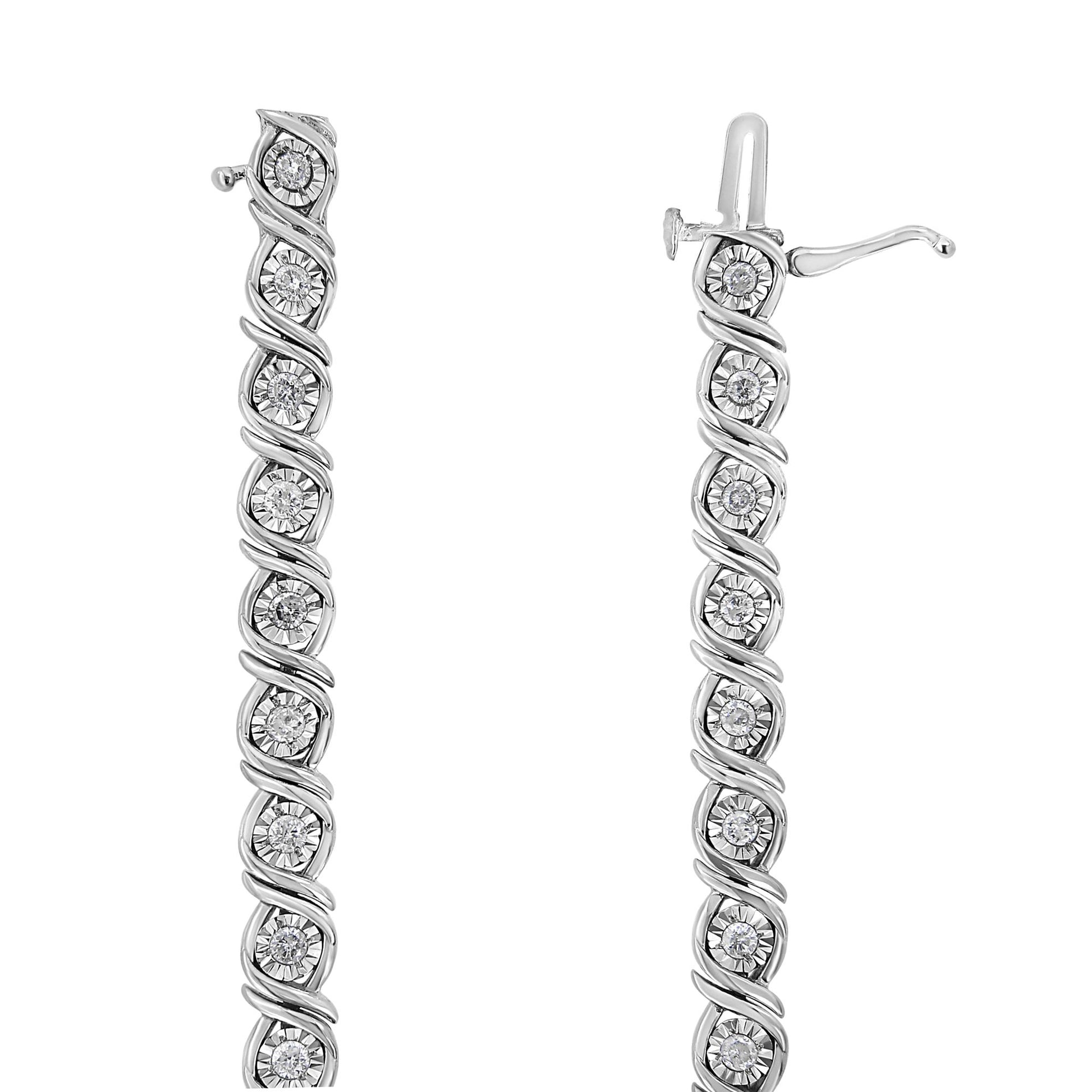 Close-up of two white metal bracelets with round white gemstones in miracle settings, shown side by side from a top-down angle.