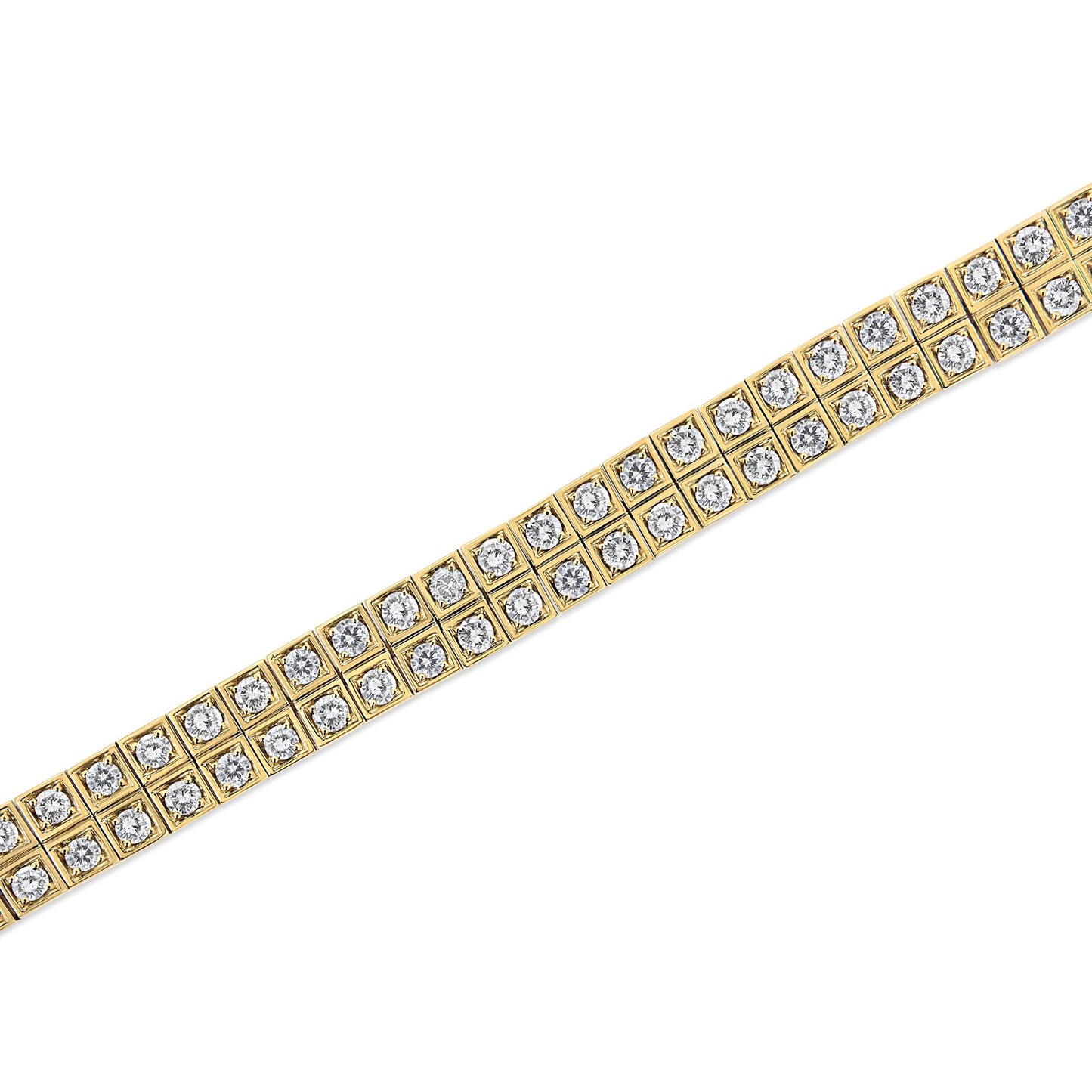 Diagonal close-up shot of a yellow metal bracelet with two rows of round white gemstones in prong settings.
