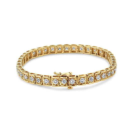 Yellow metal bracelet with round brownish gemstones set in prongs, shown from a front angled perspective.