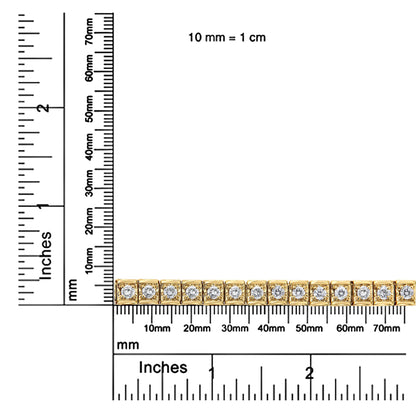 Close-up front angle of a yellow bracelet with round brownish gemstones in prong settings, displayed on rulers for size reference.