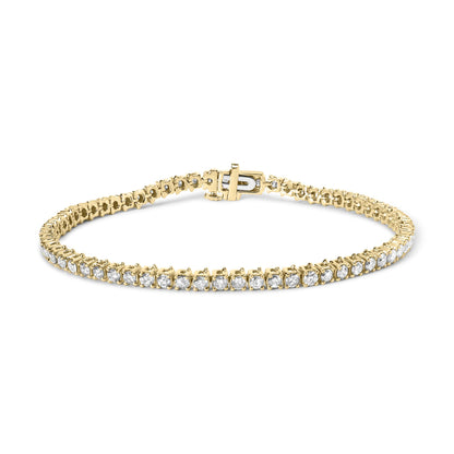 Yellow metal bracelet with prong-set round white gemstones, shown from a front angle.