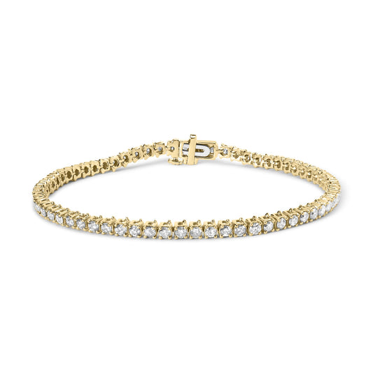 Yellow metal bracelet with prong-set round white gemstones, shown from a front angle.