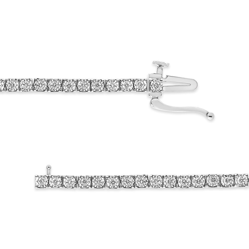Top-down view of a white metal bracelet with round white gemstones in a miracle setting, showing the clasp open on a white background.