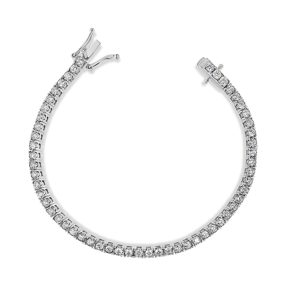 Top-down view of a white metal bracelet featuring a single row of round white gemstones in a miracle setting, unclasped and curved in a semi-circle.