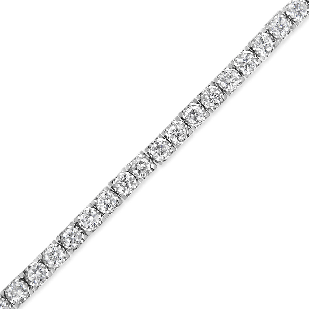 Close-up diagonal shot of a white metal bracelet featuring round white gemstones in a miracle setting.