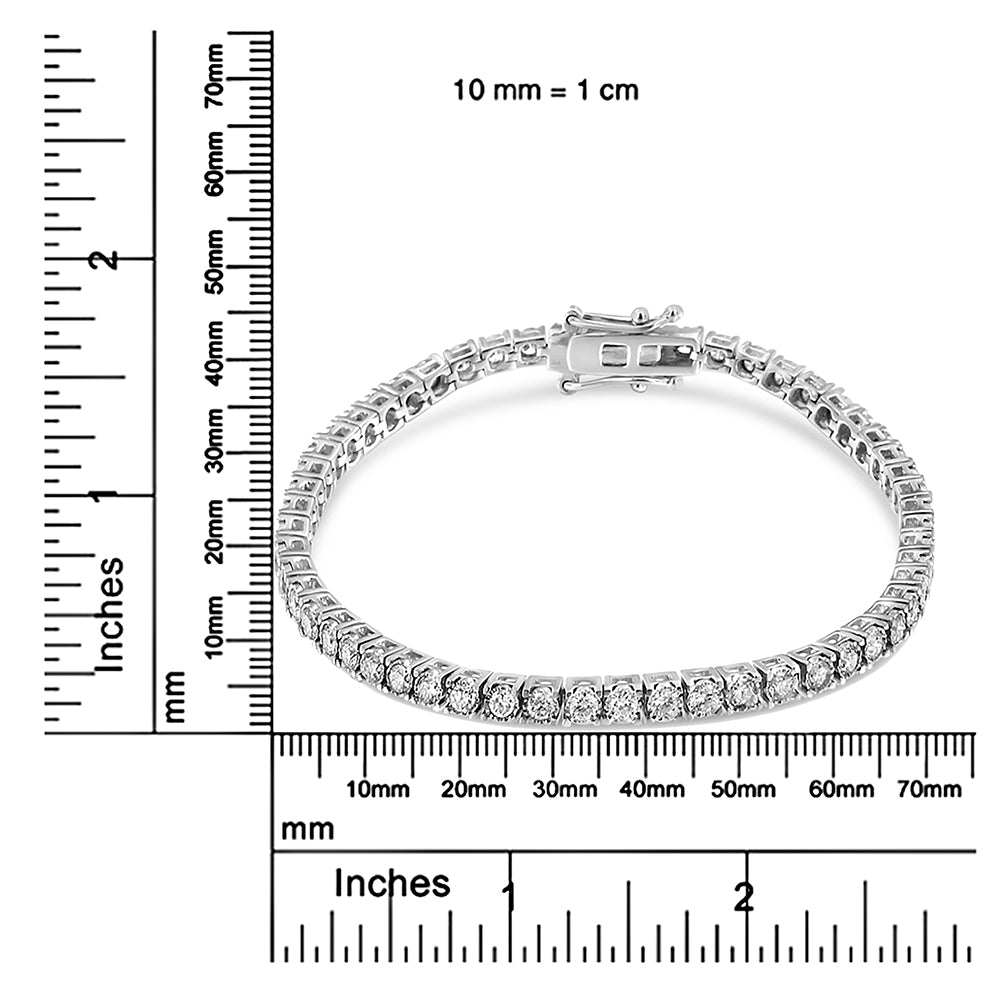 White metal bracelet with round white gemstones in miracle setting, displayed flat on a ruler for size reference, top-down angle.
