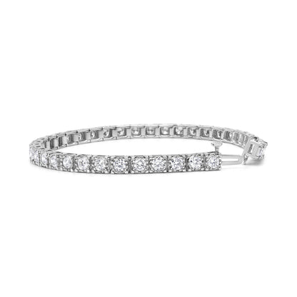 Close-up front angle of a white metal tennis bracelet featuring round white gemstones in a miracle setting.