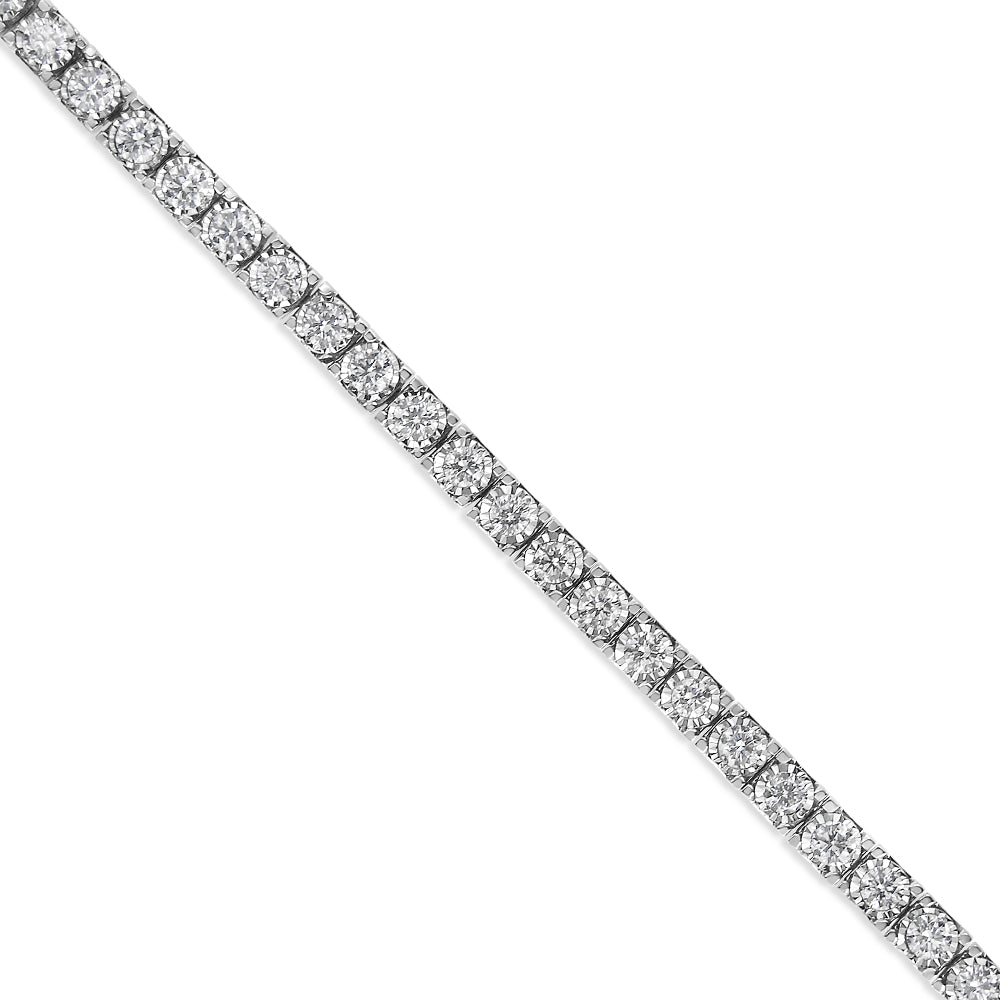 Diagonal close-up of a white metal bracelet set with multiple round white gemstones in a miracle setting.