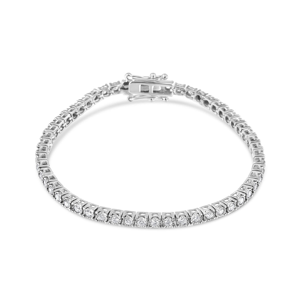 White metal bracelet with round white gemstones in a Miracle setting, shown flat from an angled top view.