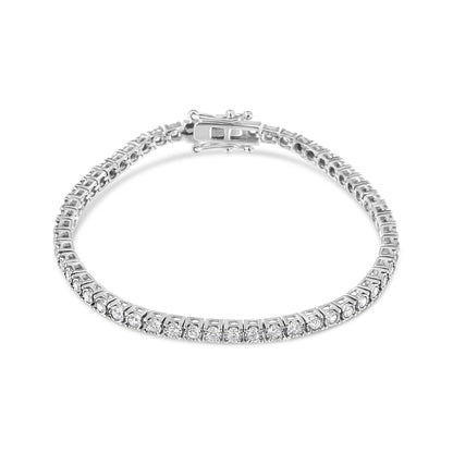 White metal bracelet with round white gemstones in a Miracle setting, shown flat from an angled top view.
