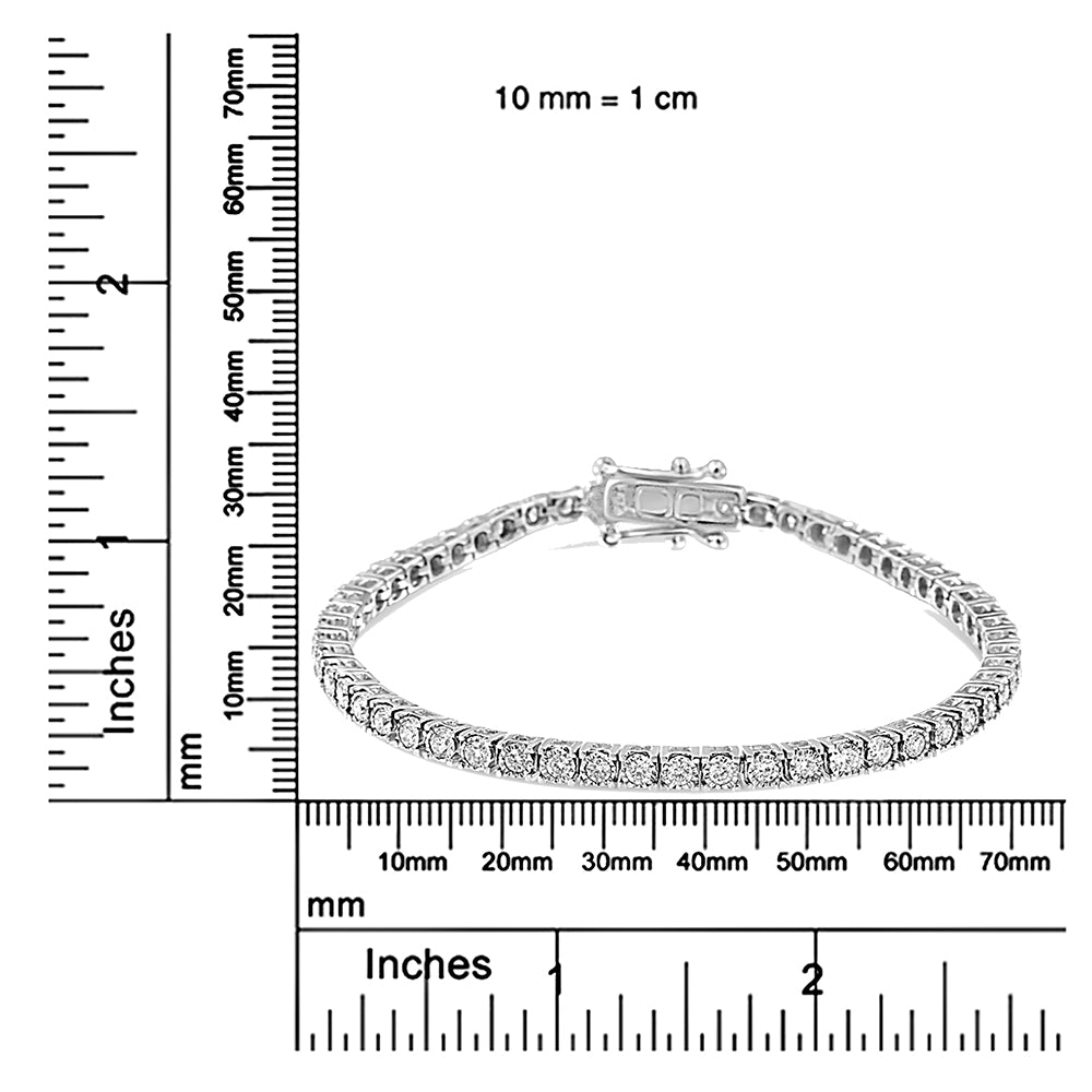 White metal bracelet with round white gemstones in miracle setting, displayed flat on a ruler for size reference, front angle view.