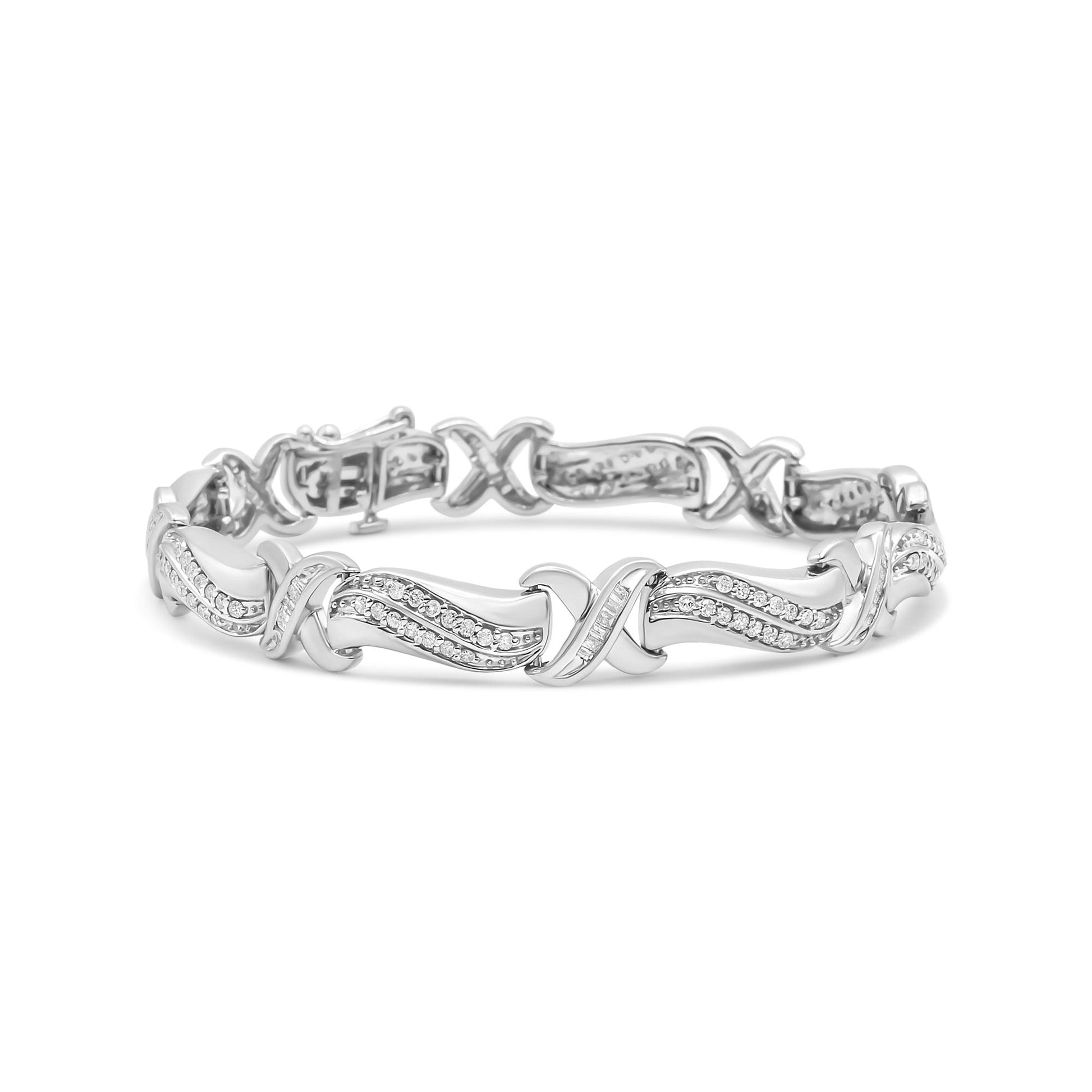 White metal bracelet with crisscross and wave design featuring round and baguette shaped white gemstones, shown from front angle.