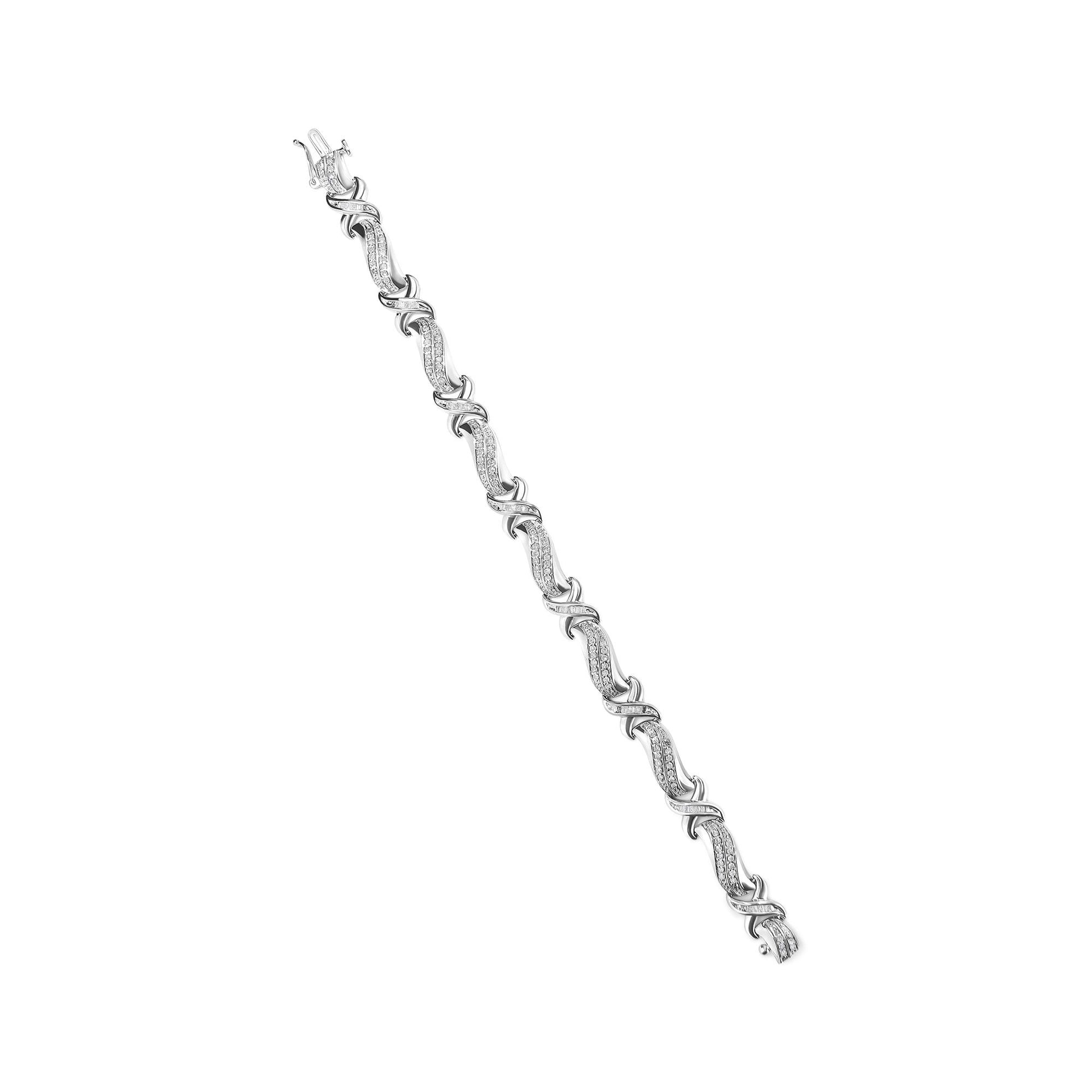 White metal bracelet with intertwining design, adorned with round and baguette shaped white gemstones in prong and channel settings, shown from a top-down angle on a white background.