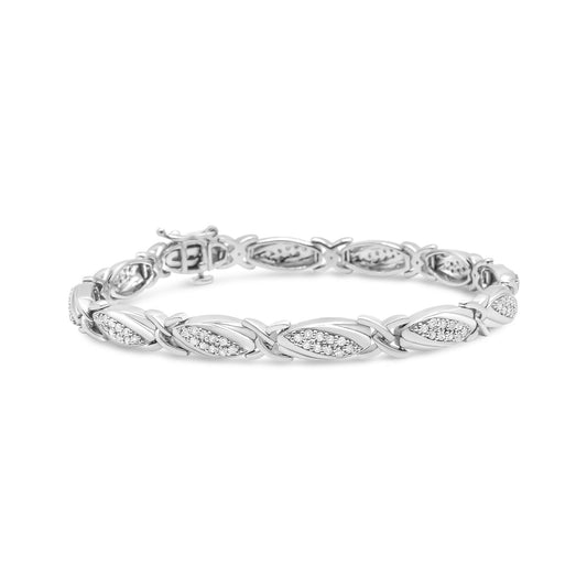 White metal bracelet with alternating marquise-shaped links set with white round gemstones in prong settings, shown at a slight angle.