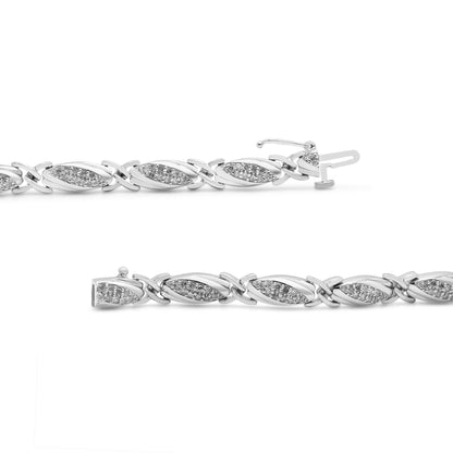 Close-up front angle of a white metal bracelet featuring alternating oval and X-shaped links, each oval link set with multiple small round white gemstones in prong settings.