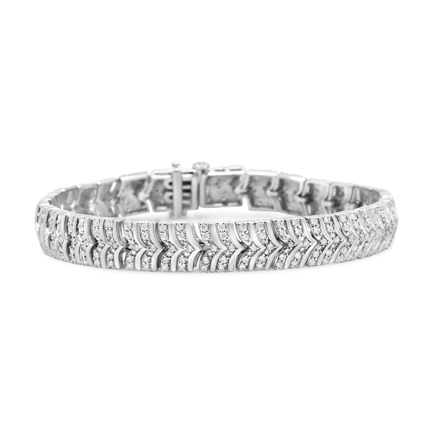 White metal bracelet with pave set round white gemstones in a chevron pattern, shown from a front angled view.