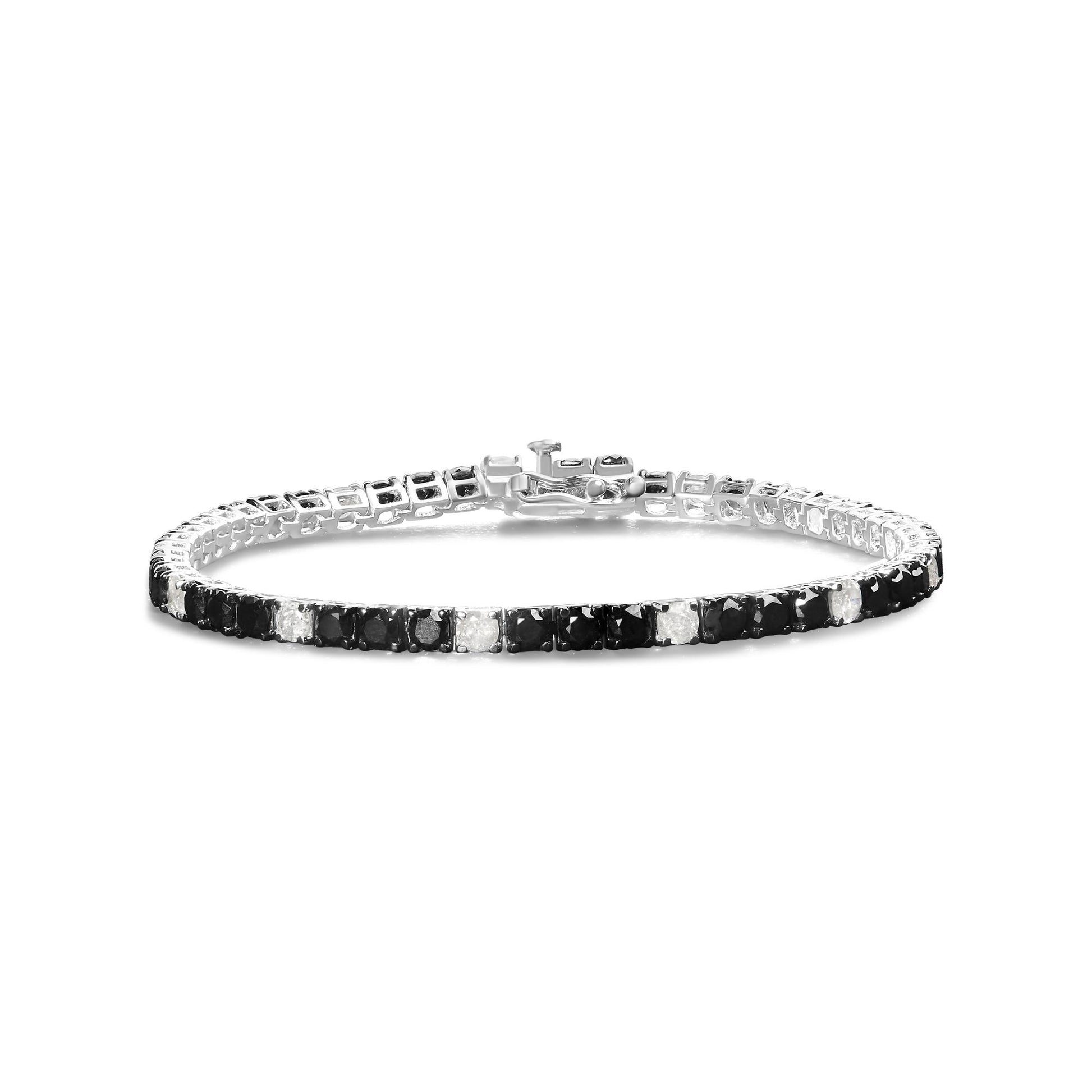 White bracelet with alternating black and white round gemstones in prong settings, shown from a front angle on a white background.