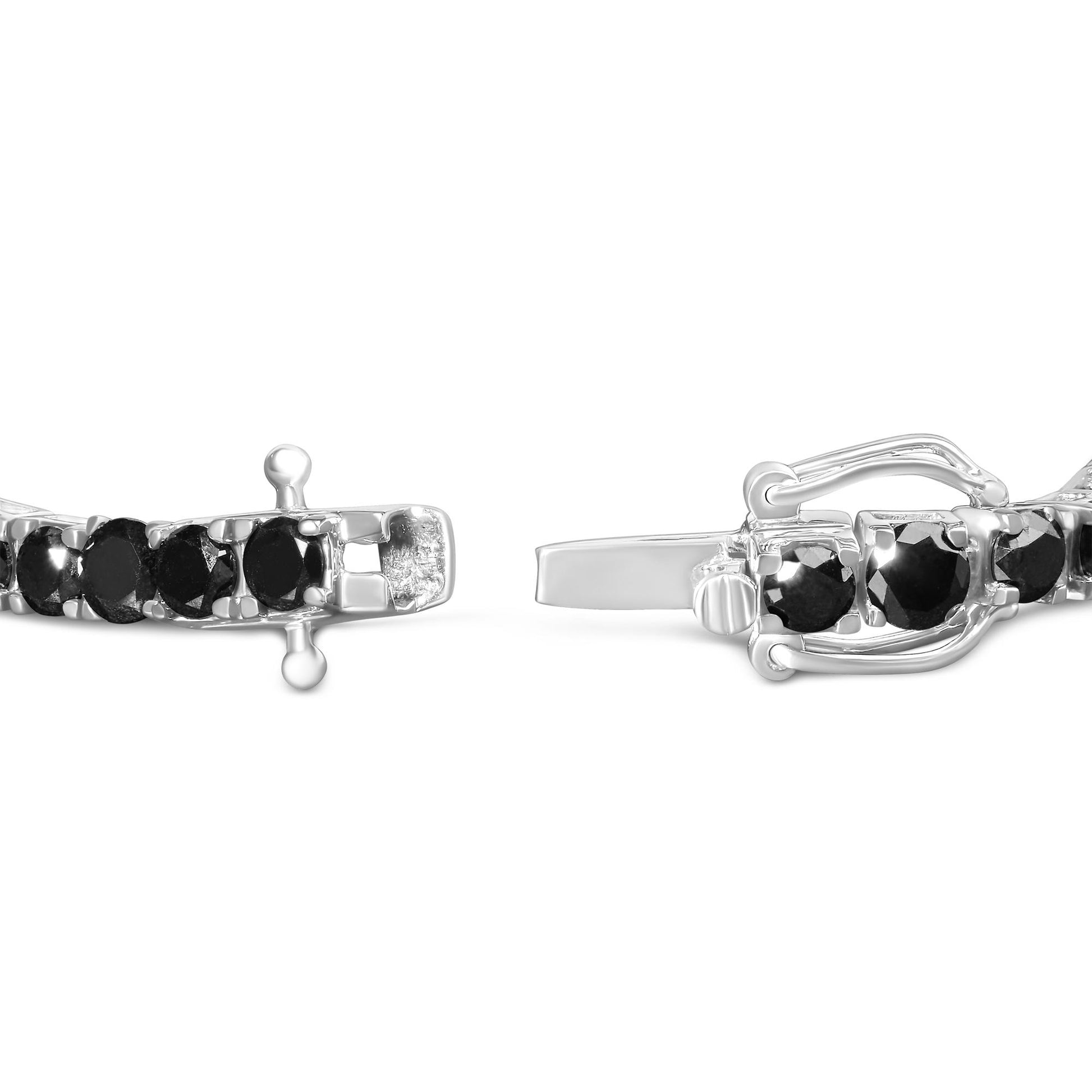 Close-up side view of white metal bracelet with round black gemstones in prong settings, showing clasp mechanism.