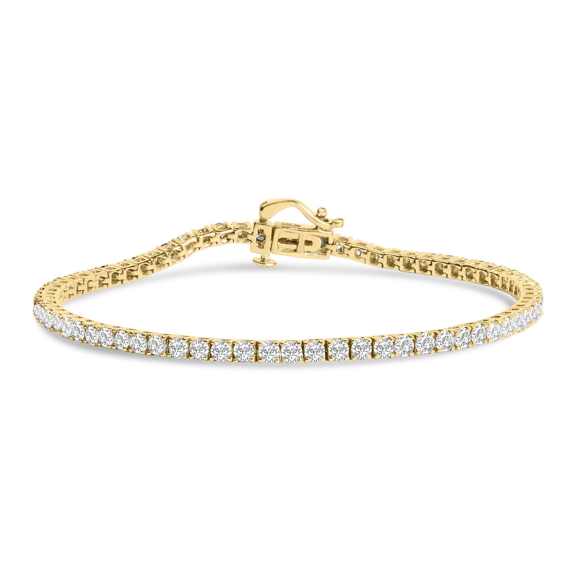 Yellow metal bracelet with round white gemstones in 4-prong settings, shown from a straight-on angle.