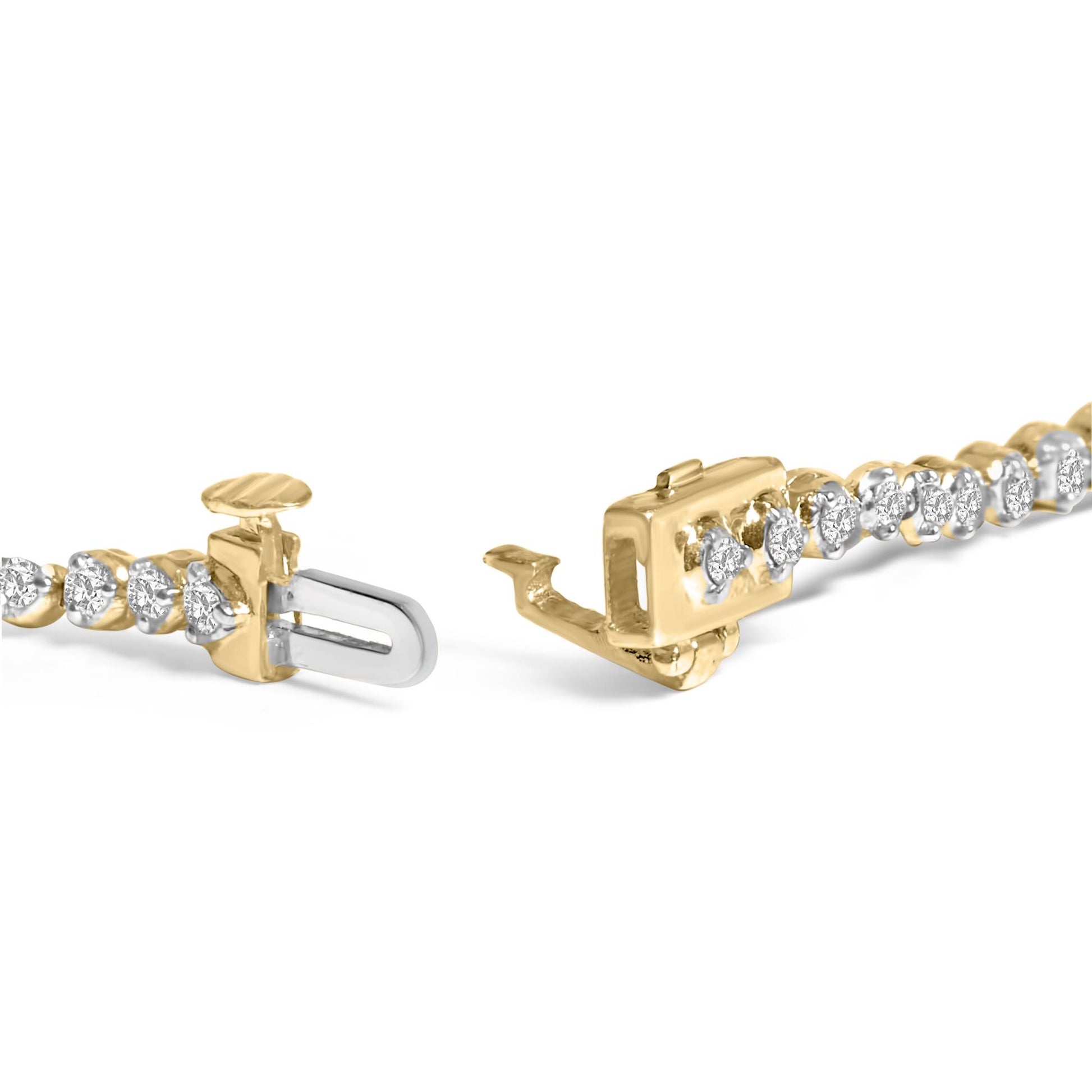 Close-up side angle of a yellow bracelet with round white gemstones in prong settings, showing the open clasp detail.