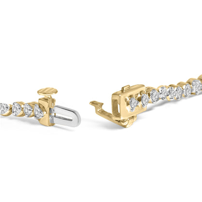 Close-up side angle of a yellow bracelet with round white gemstones in prong settings, showing the open clasp detail.