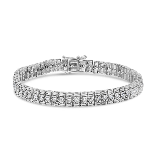 White metal bracelet with round white gemstones set in prong settings, shown from the front angle.