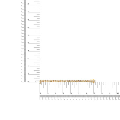 Yellow bracelet with round brownish gemstones in 4-prong settings, laid flat on a ruler for size reference, shot from above.