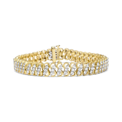 Yellow metal bracelet with multiple rows of round white gemstones in shared prong settings, shown from a front angled view.