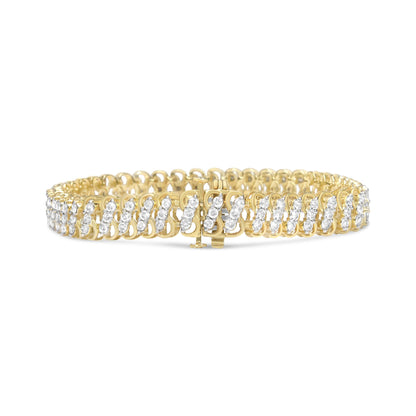 Yellow metal bracelet with two rows of round white gemstones in shared prong setting, shown from a front angle.