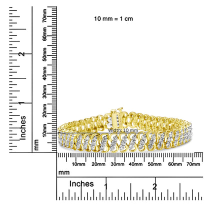 Yellow metal bracelet with rows of round white gemstones in shared prong settings, photographed from a front angle, placed on rulers for size reference.