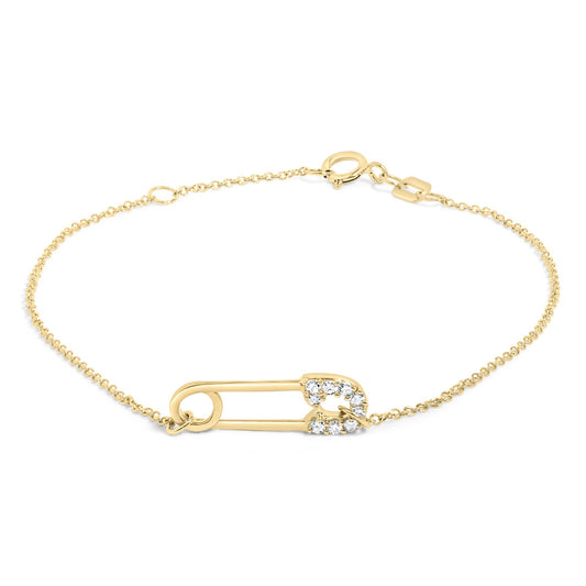 Yellow metal bracelet with a safety pin design adorned with white round gemstones in prong settings, shown flat on a white background from a top angle.