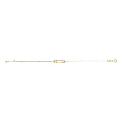 Yellow metal bracelet with a safety pin-shaped centerpiece adorned with white round gemstones, shown from a top-down angle on a white background.
