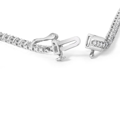 Close-up of a white bracelet clasp with round white gemstones in four-prong settings, shown against a white background at a slight angle.