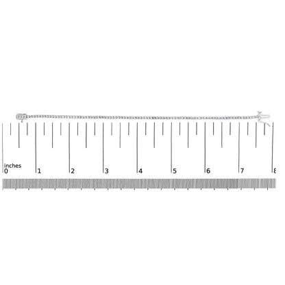 Top-down view of a white metal bracelet set with round white gemstones in 4-prong settings, displayed on a ruler for size reference.